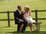 Wedding Couple sat on a bench